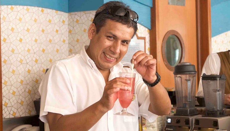 a bartender mixing a cocktail